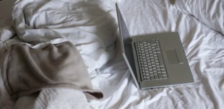 Daily Bite Wellness Tip - Don't Work In Bed - Featured Image